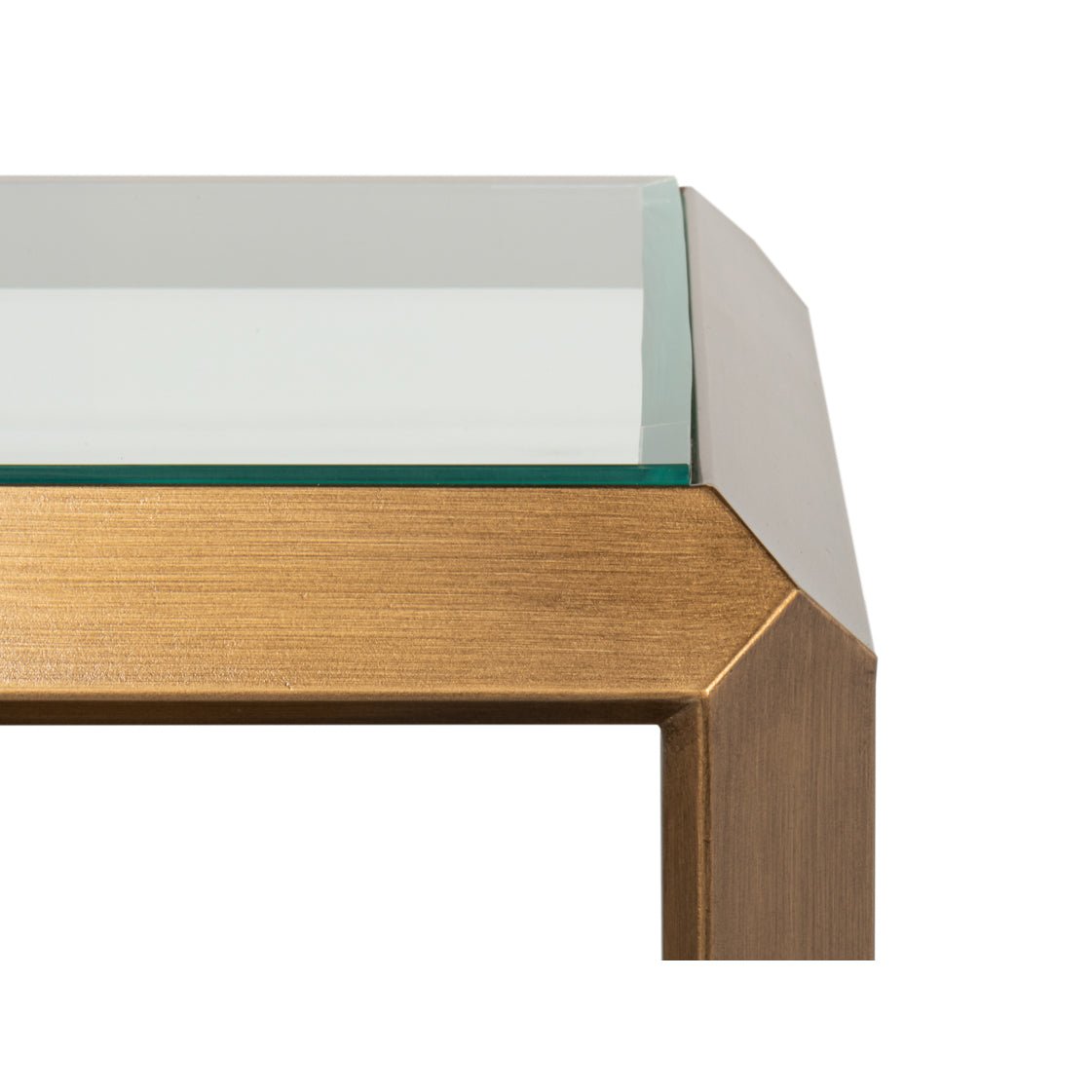 Close-up of glass and brass corner accent table.