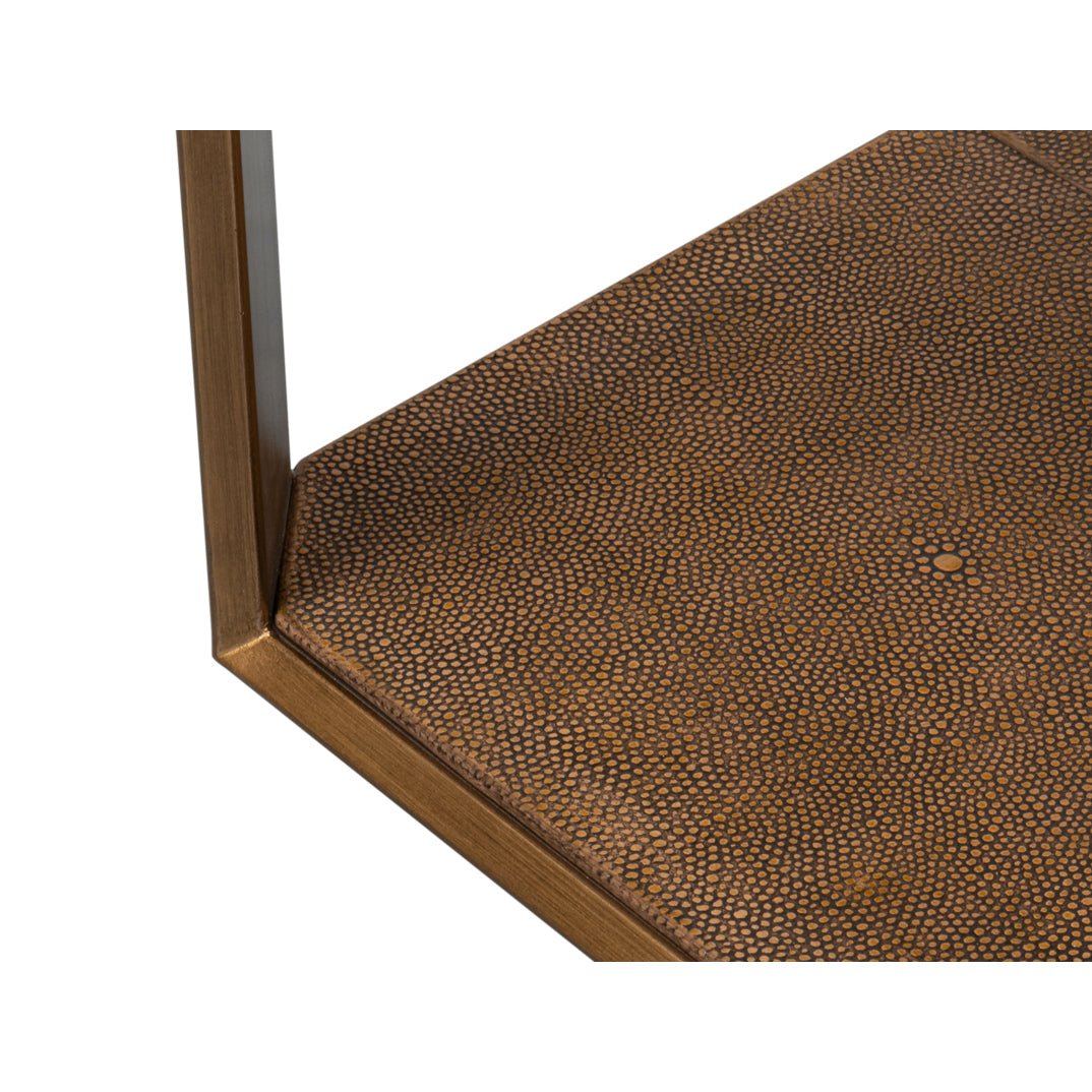 Detailed texture on base of modern brass accent table.
