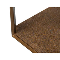Detailed texture on base of modern brass accent table.