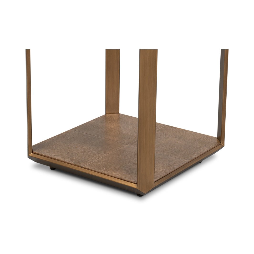 Base and leg detail on modern brass accent table.