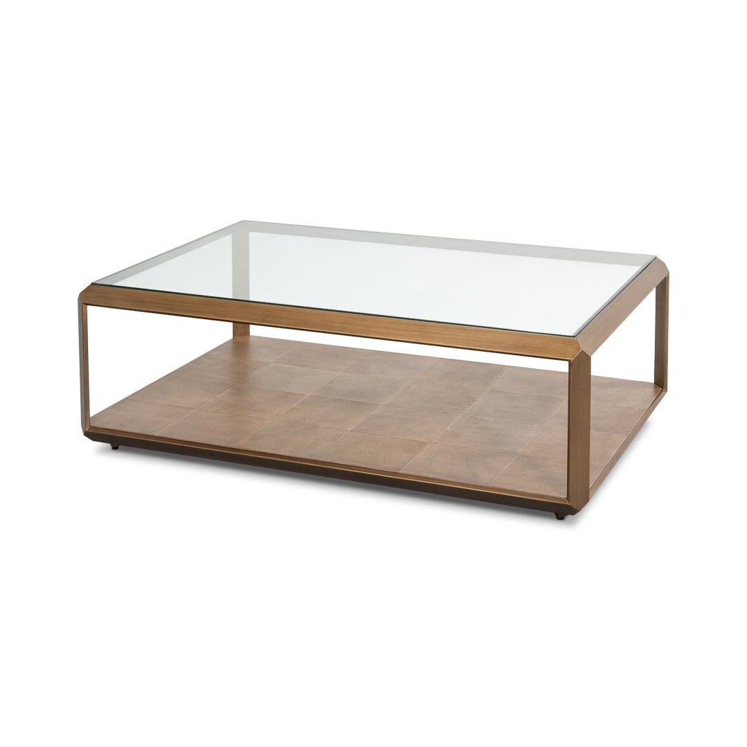 Modern brass finish coffee table with glass top.