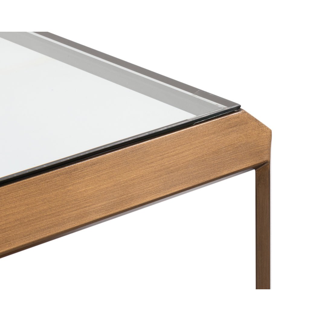 Detailed edge view, coffee table brass and glass.
