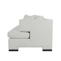 Side view of modern white upholstered sofa