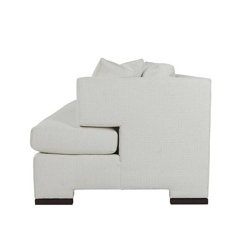 Side view of modern white upholstered sofa