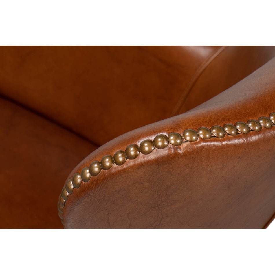 Brown leather desk chair nailhead trim detail