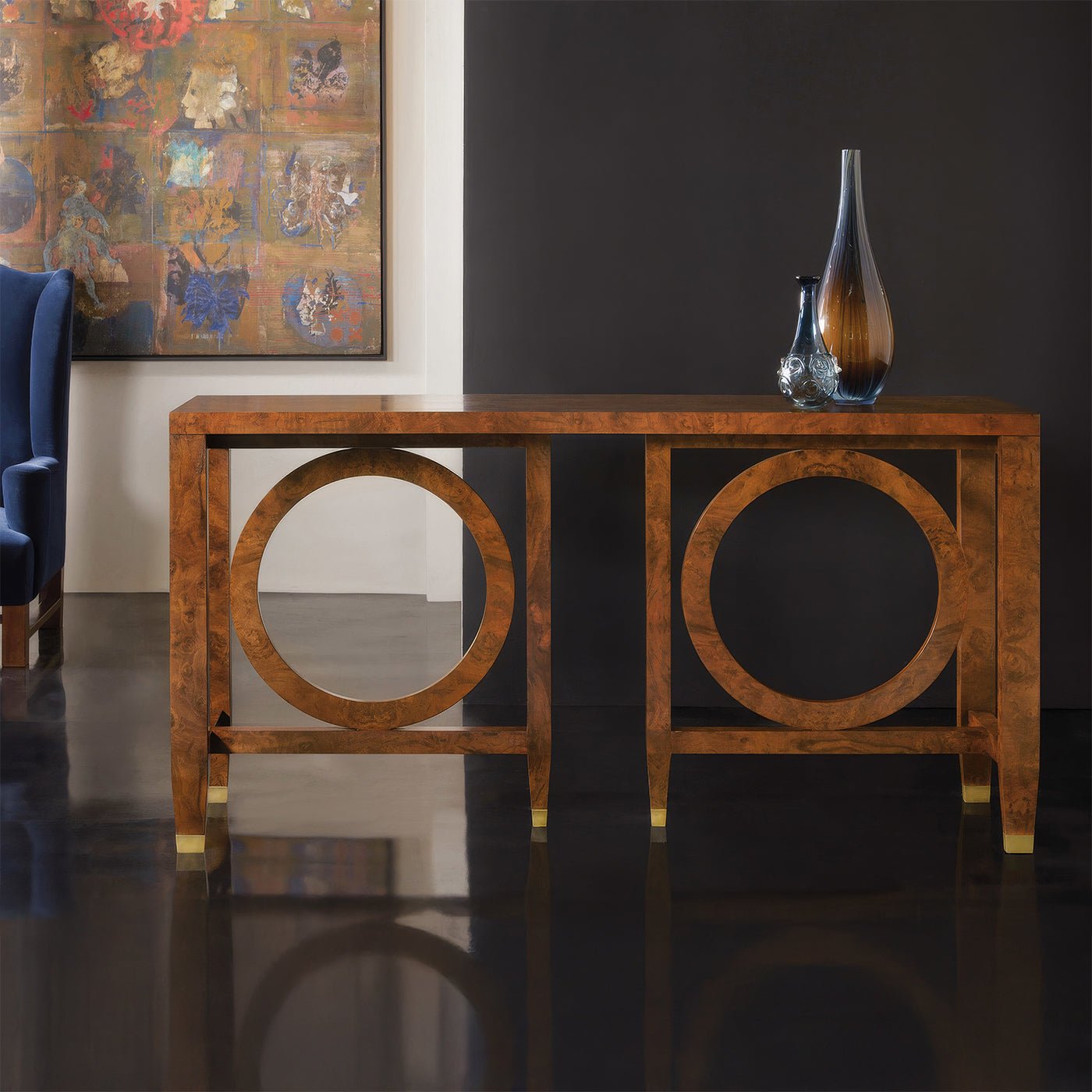 Burl walnut console table styled in living room.