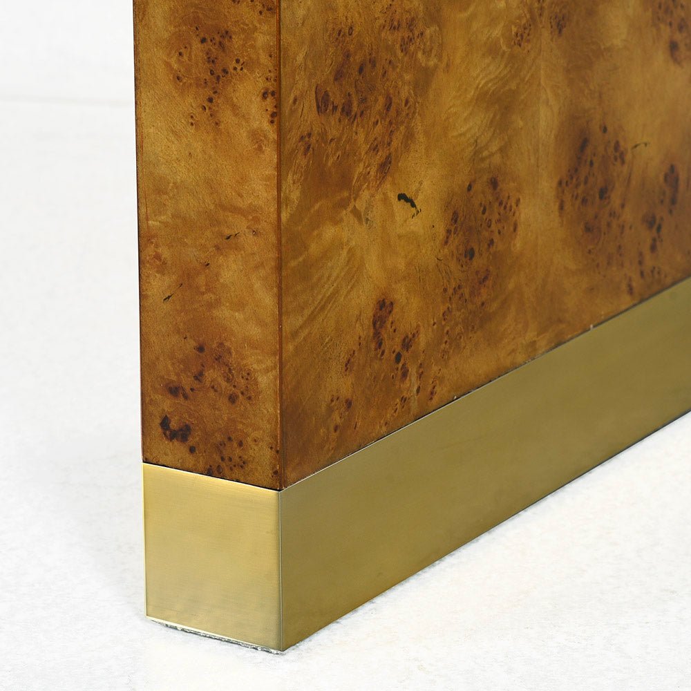 Corner close-up of modern burl wood console table.