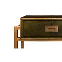 Corner close-up of console table, green leather and gold.