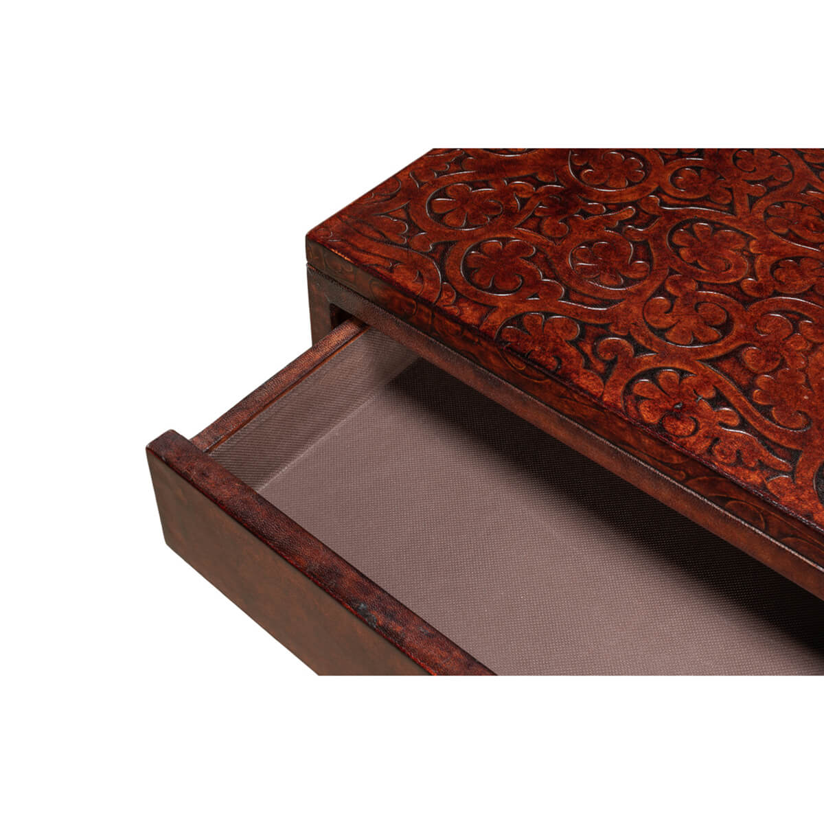 Close-up of ornate carved pattern on console table drawer.