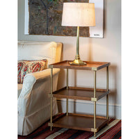 Etagere side table with lamp, sofa setting.