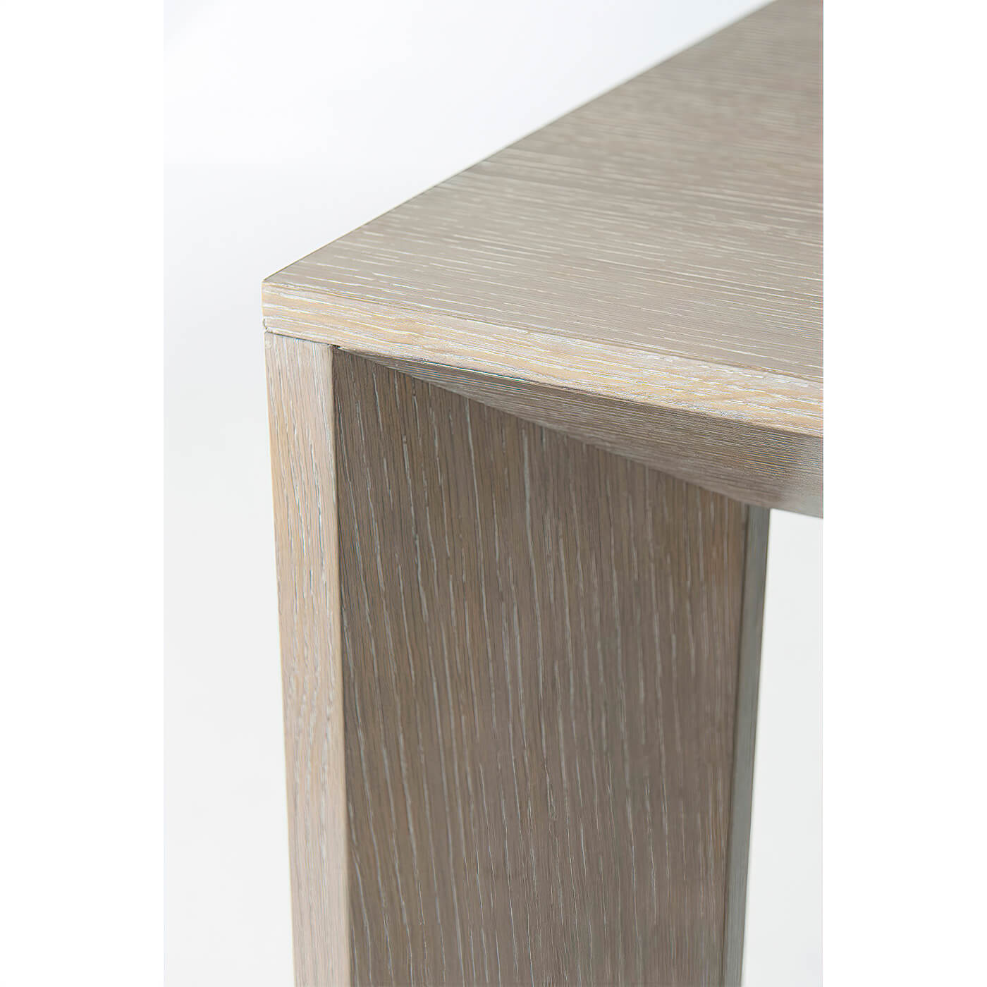 Modern cerused oak dining table, corner detail.