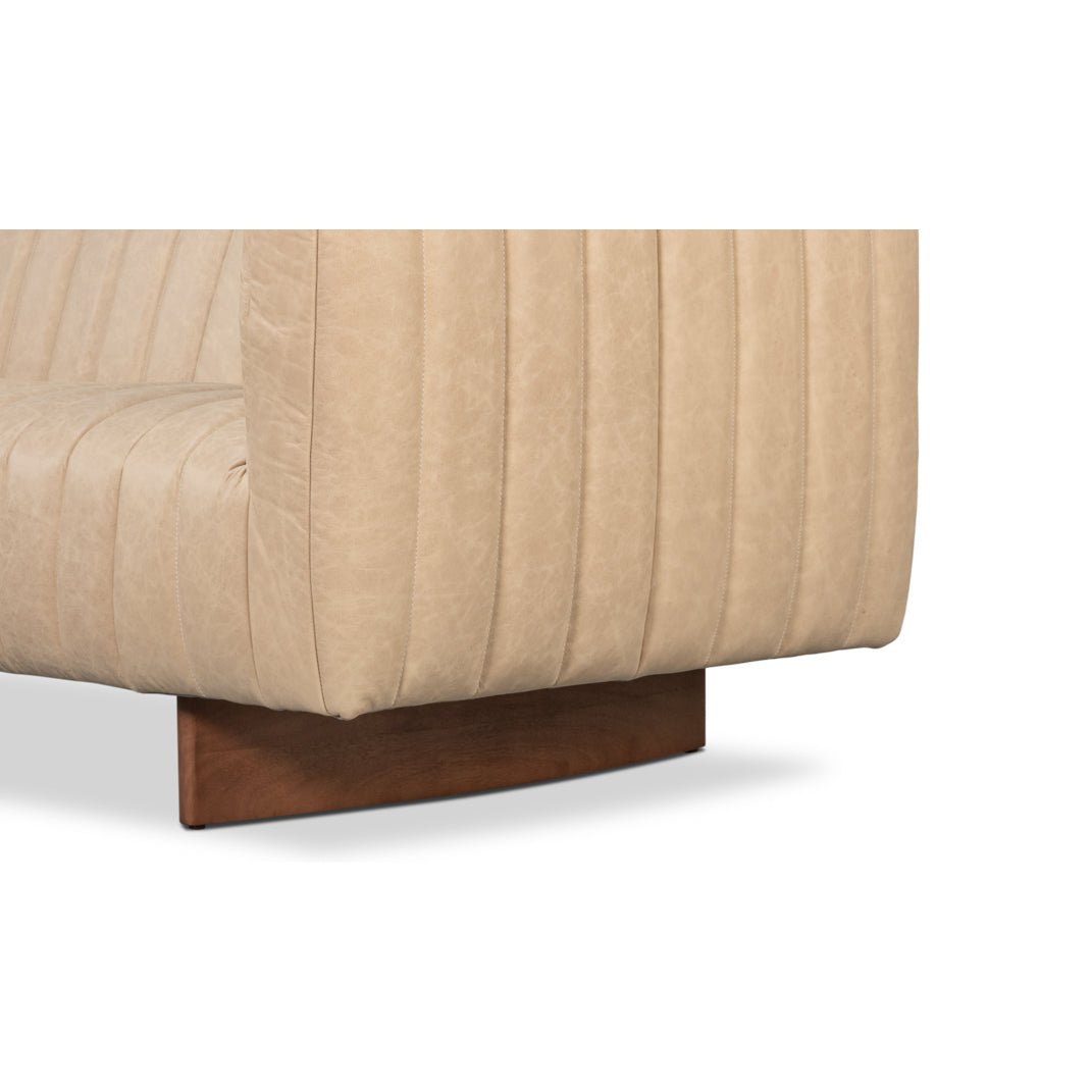 Sofa leg detail, wooden base on modern leather sofa.