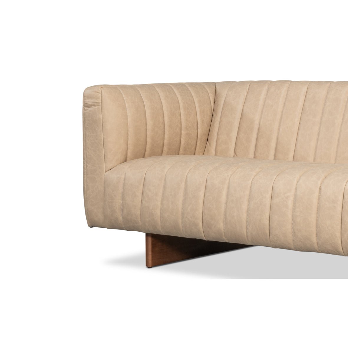 Sofa arm corner, modern white tufted leather focus.