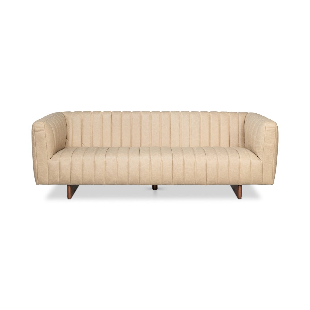 Front view of modern tufted leather sofa, vertical lines.
