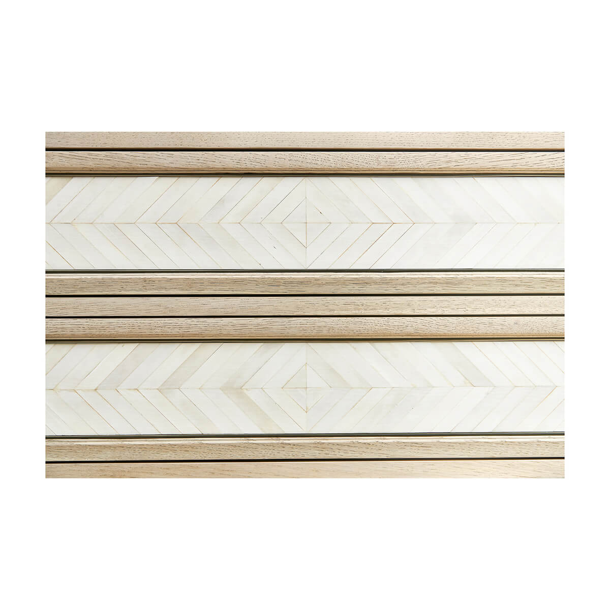 Detailed view of chevron parquetry drawer fronts.