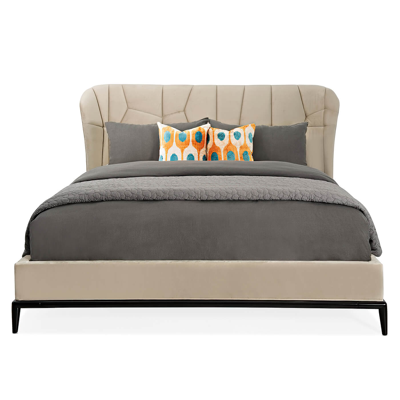 Front view of modern upholstered bed with patterned pillows.