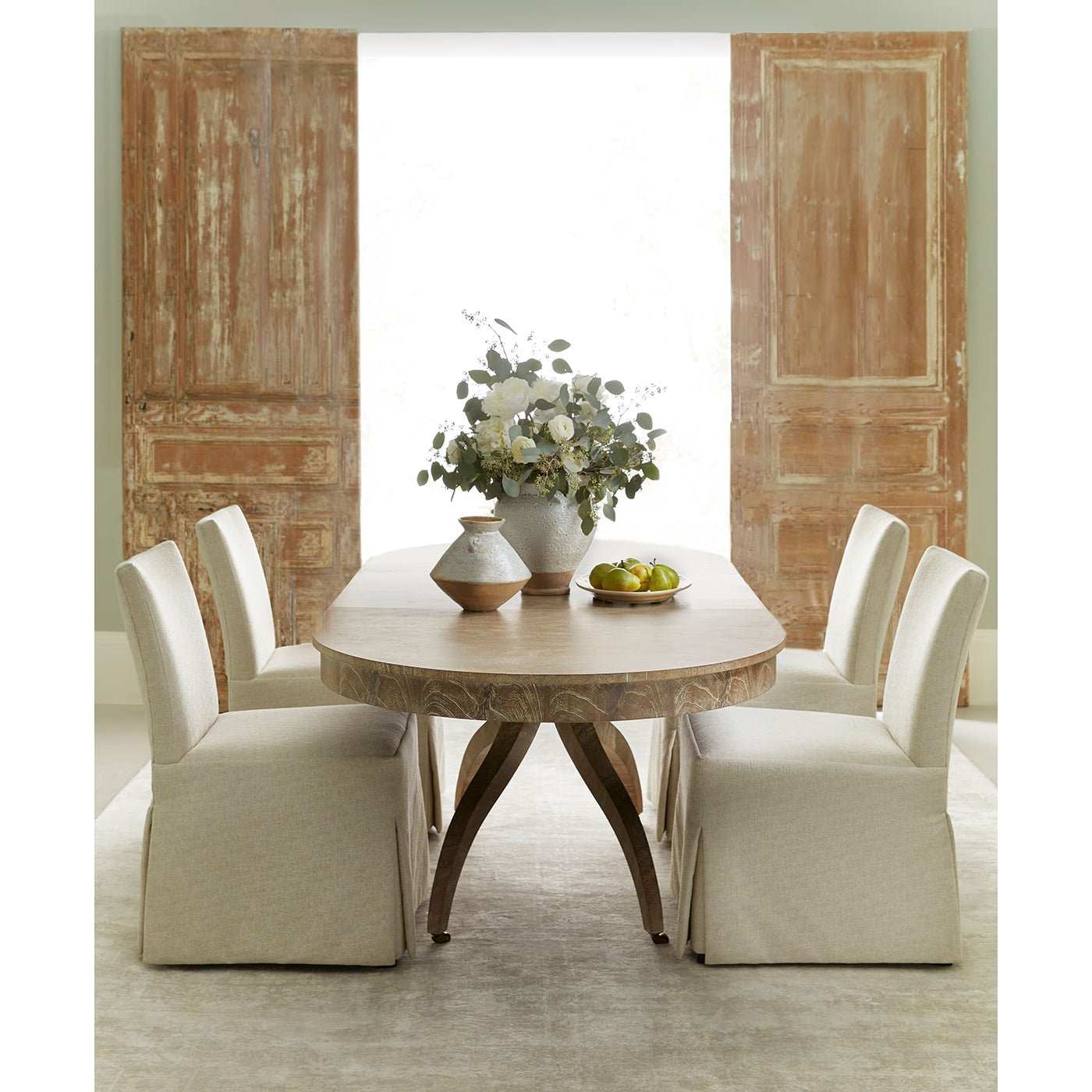 Modern Classical dining table in elegant dining room setup.