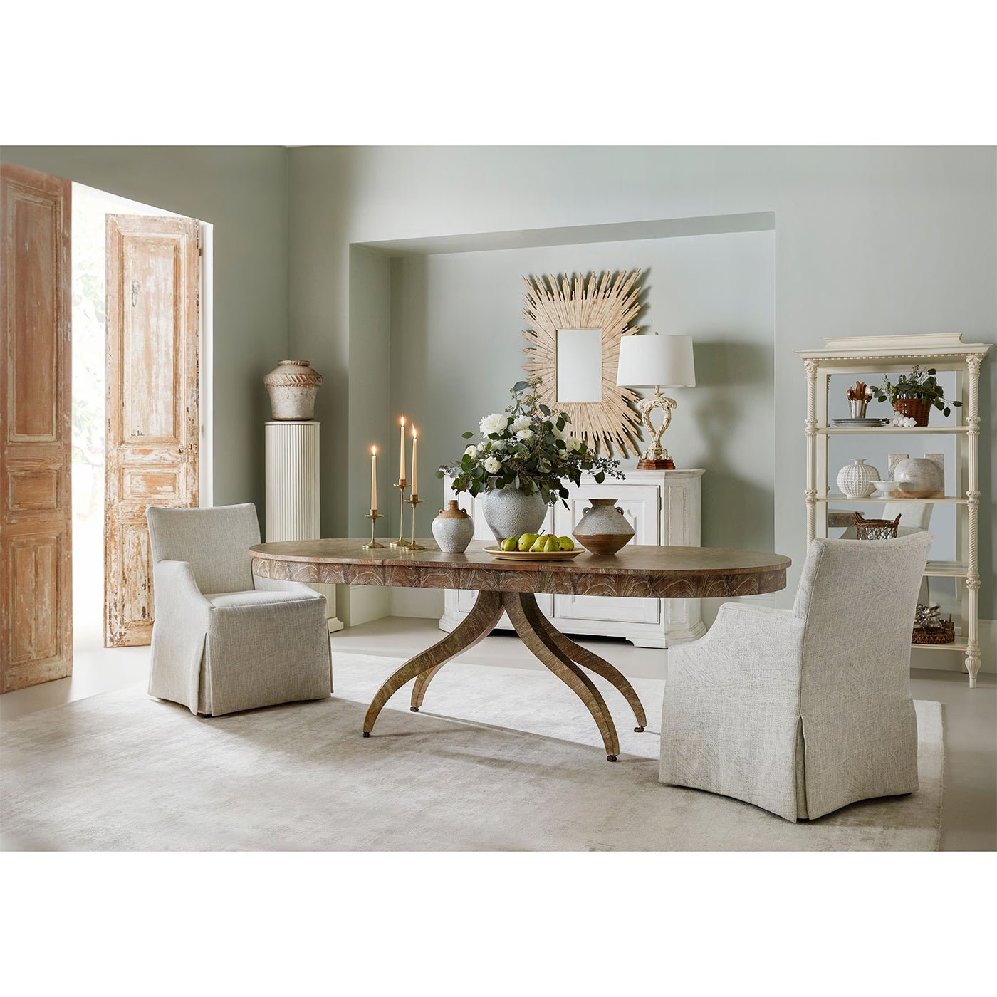 Modern Classical dining table, styled in a spacious dining room.