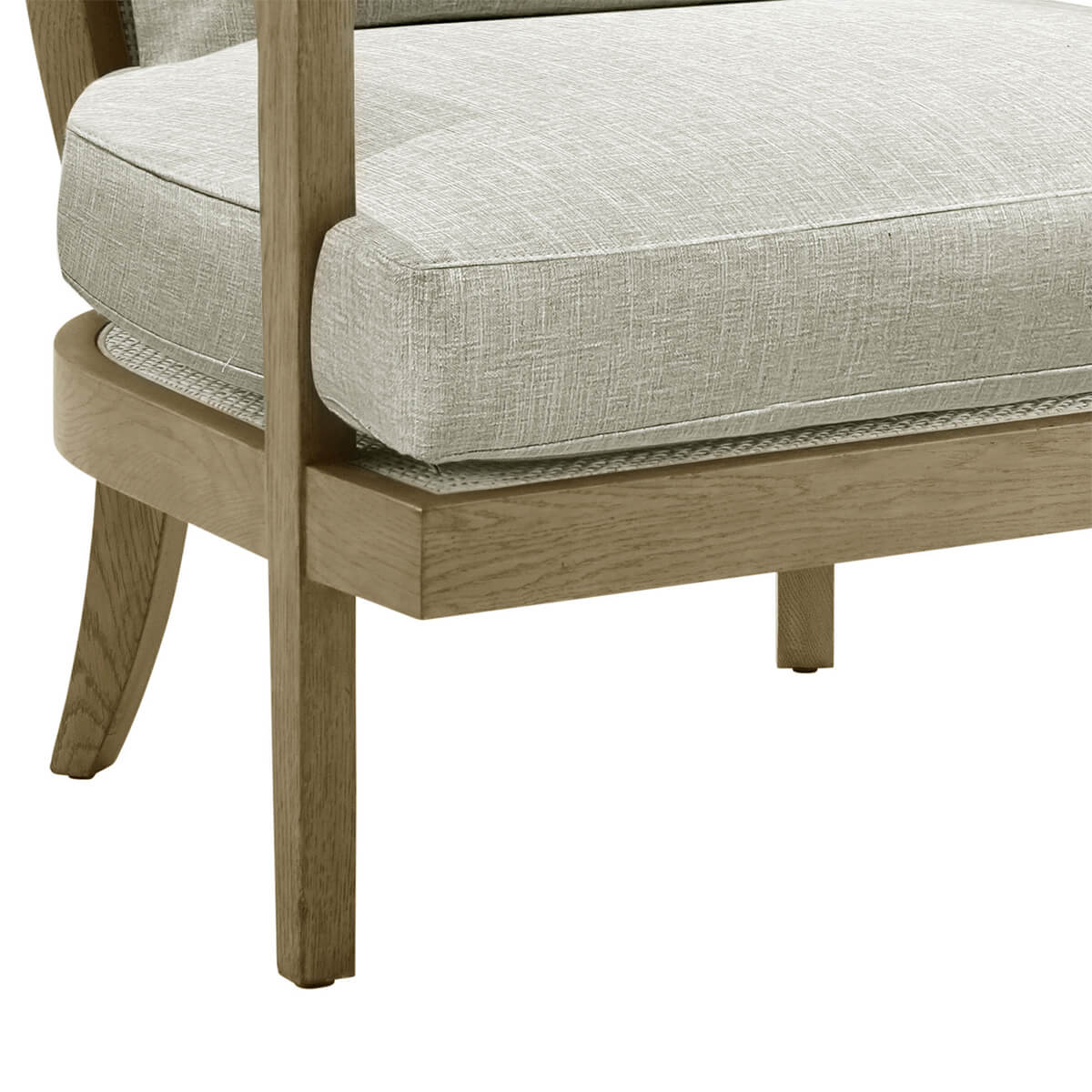 Detail of armchair seat and wooden legs.
