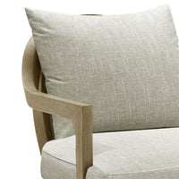Close-up of cushion and armrest on armchair.