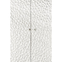 Close-up of textured cabinet doors with handles.