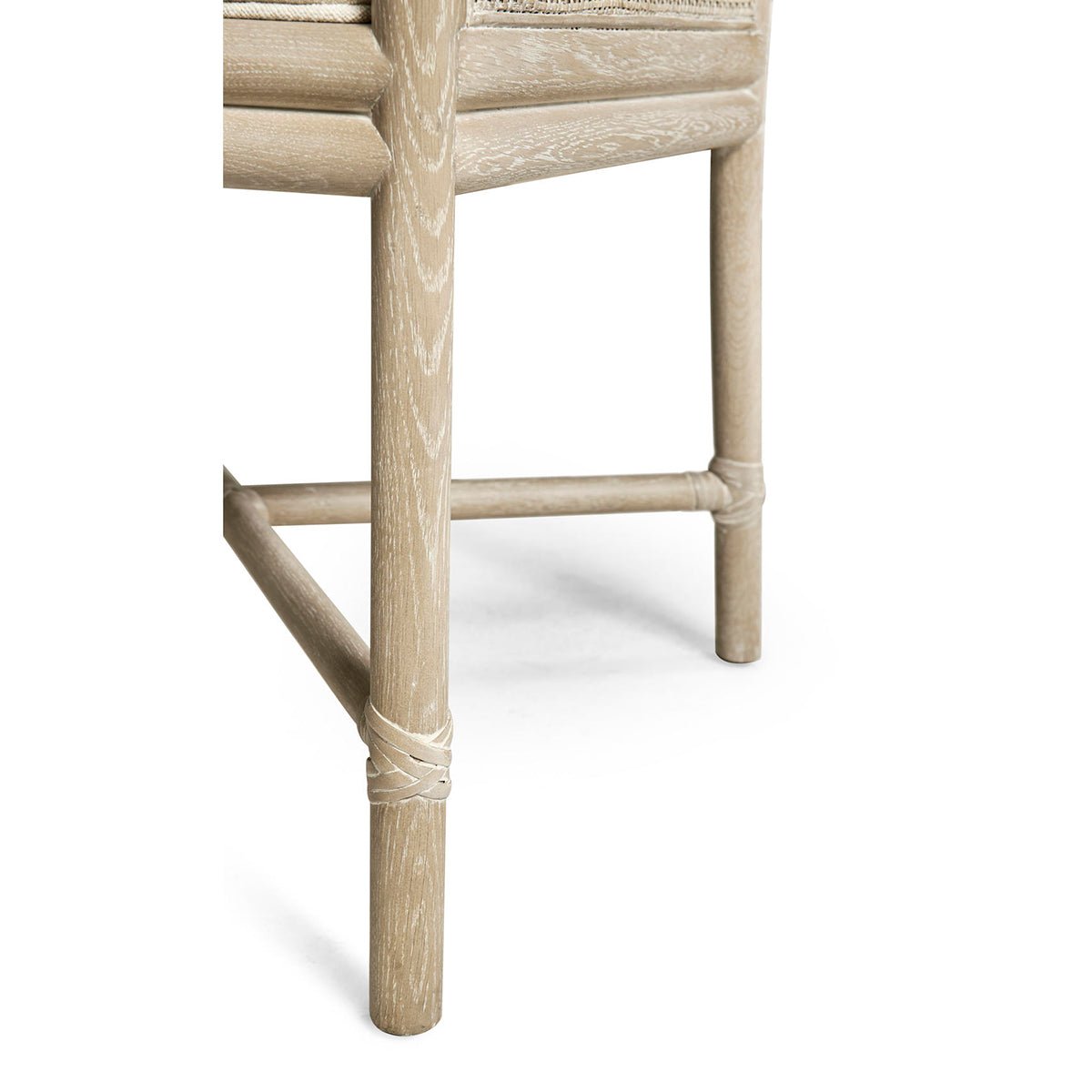 Coastal dining chair leg showing natural wood texture.
