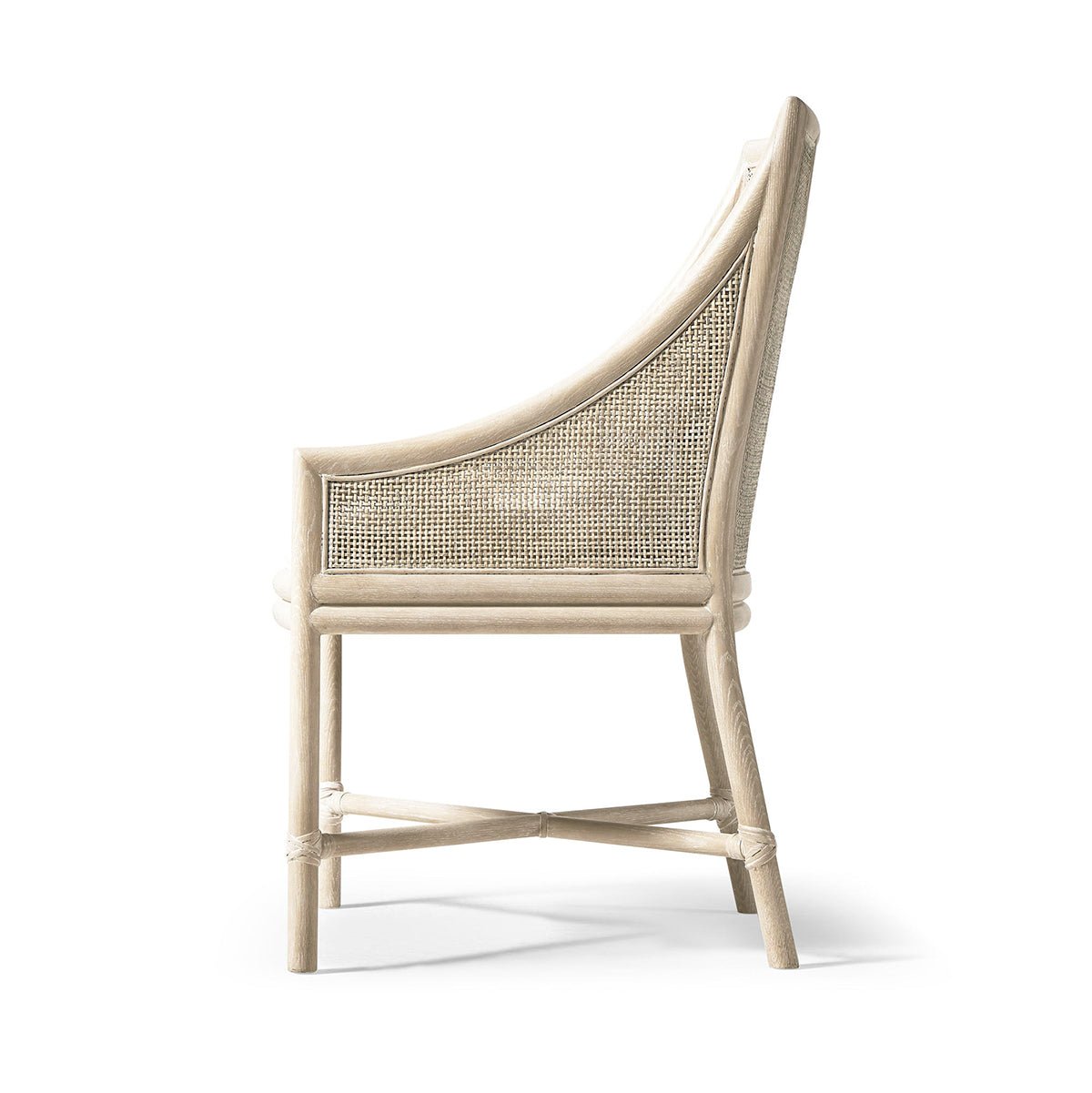 Coastal dining chair, side profile showing woven back.