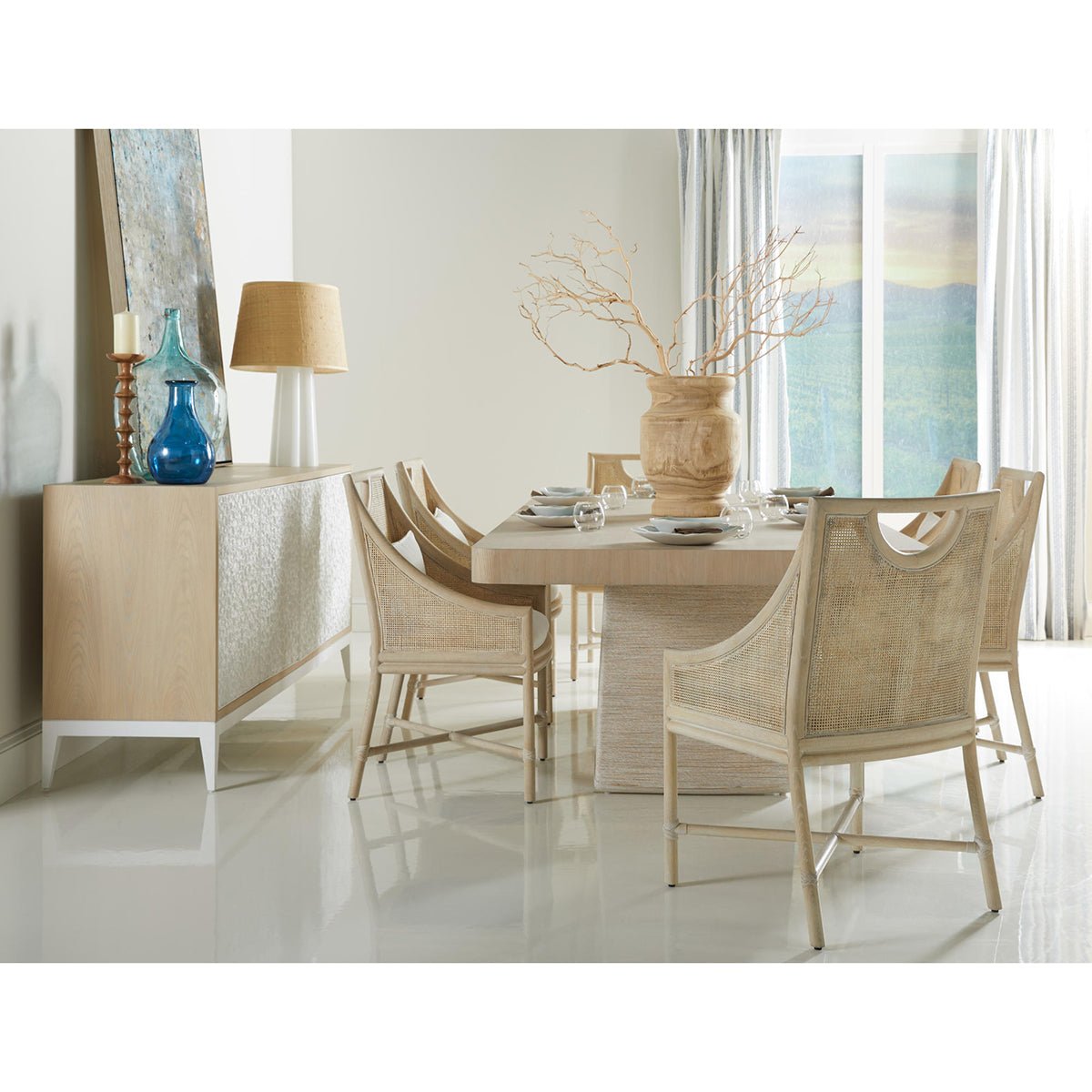 Dining room with set of coastal dining chairs.