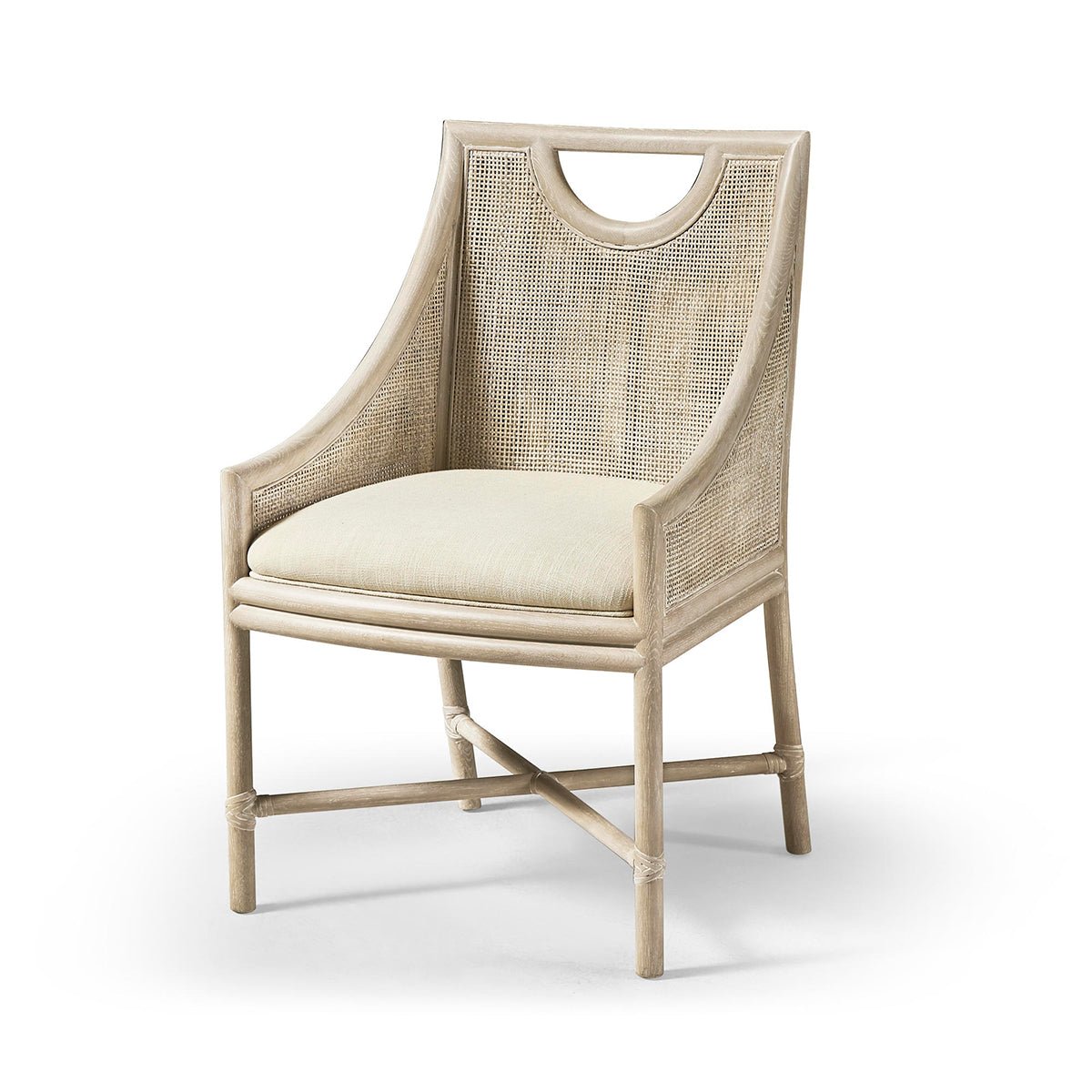 Coastal dining chair with cushion, slightly angled view.