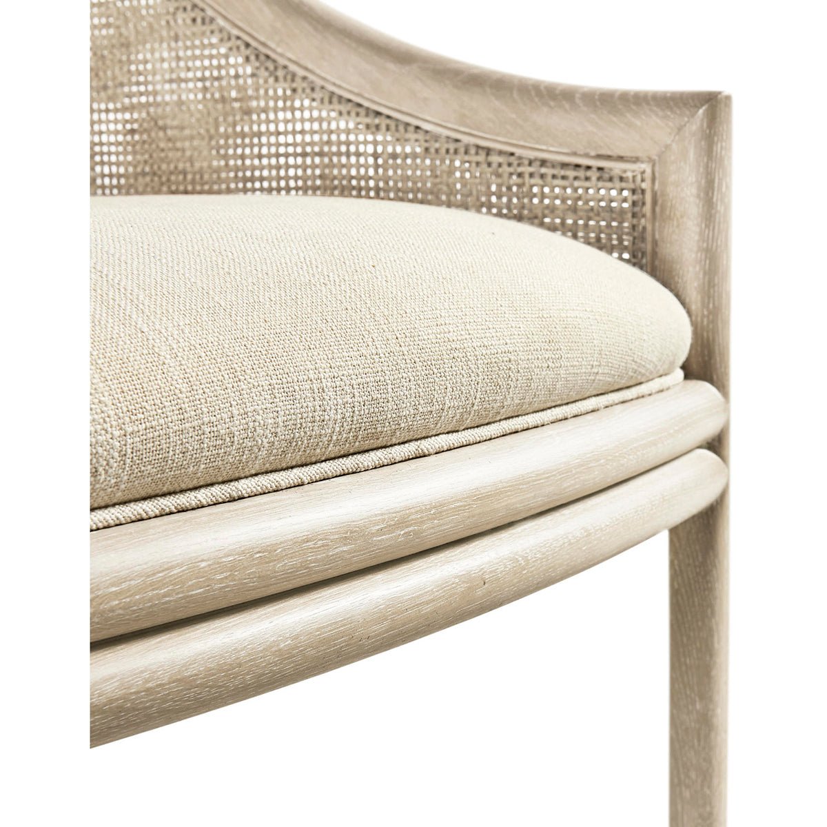Coastal dining chair seat detail with beige cushion.
