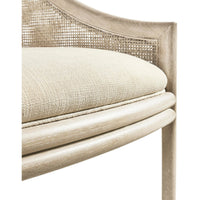 Coastal dining chair seat detail with beige cushion.
