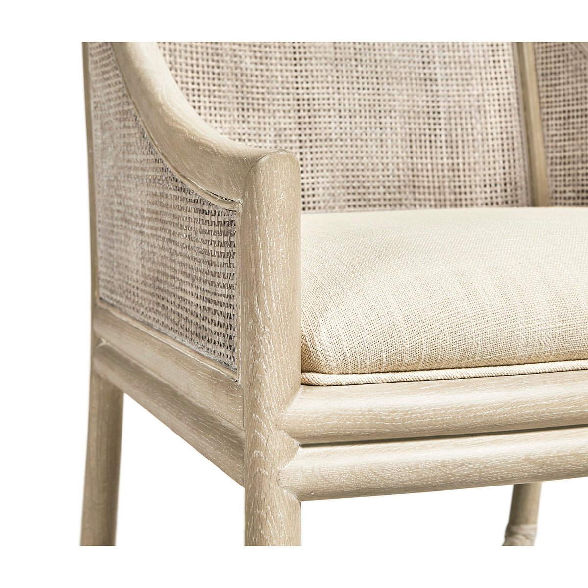 Close-up of coastal dining chair arm and cushion.