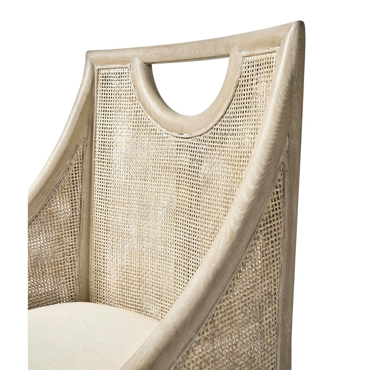 Close-up of coastal dining chair's woven back detail.