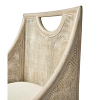 Close-up of coastal dining chair's woven back detail.