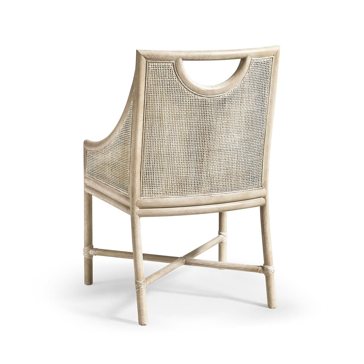 Coastal dining chair, back view featuring wicker design.