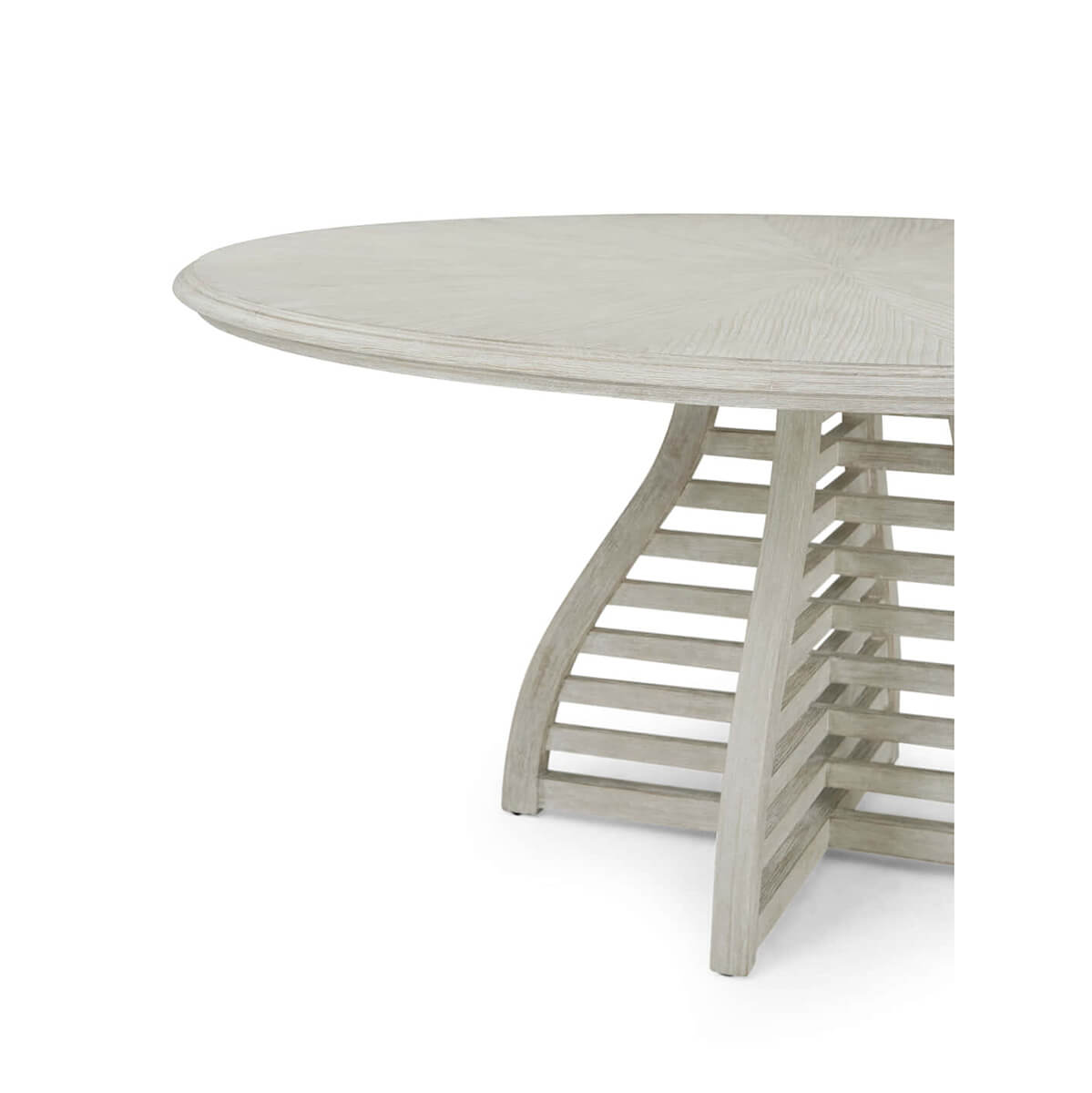 Close-up of dining table edge and lattice base.