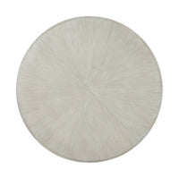 Top view of round dining table, textured surface.
