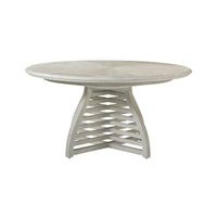 Round table with unique base design, side angle.