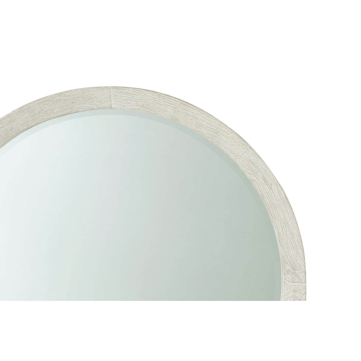Close-up of round mirror's upper frame detail.