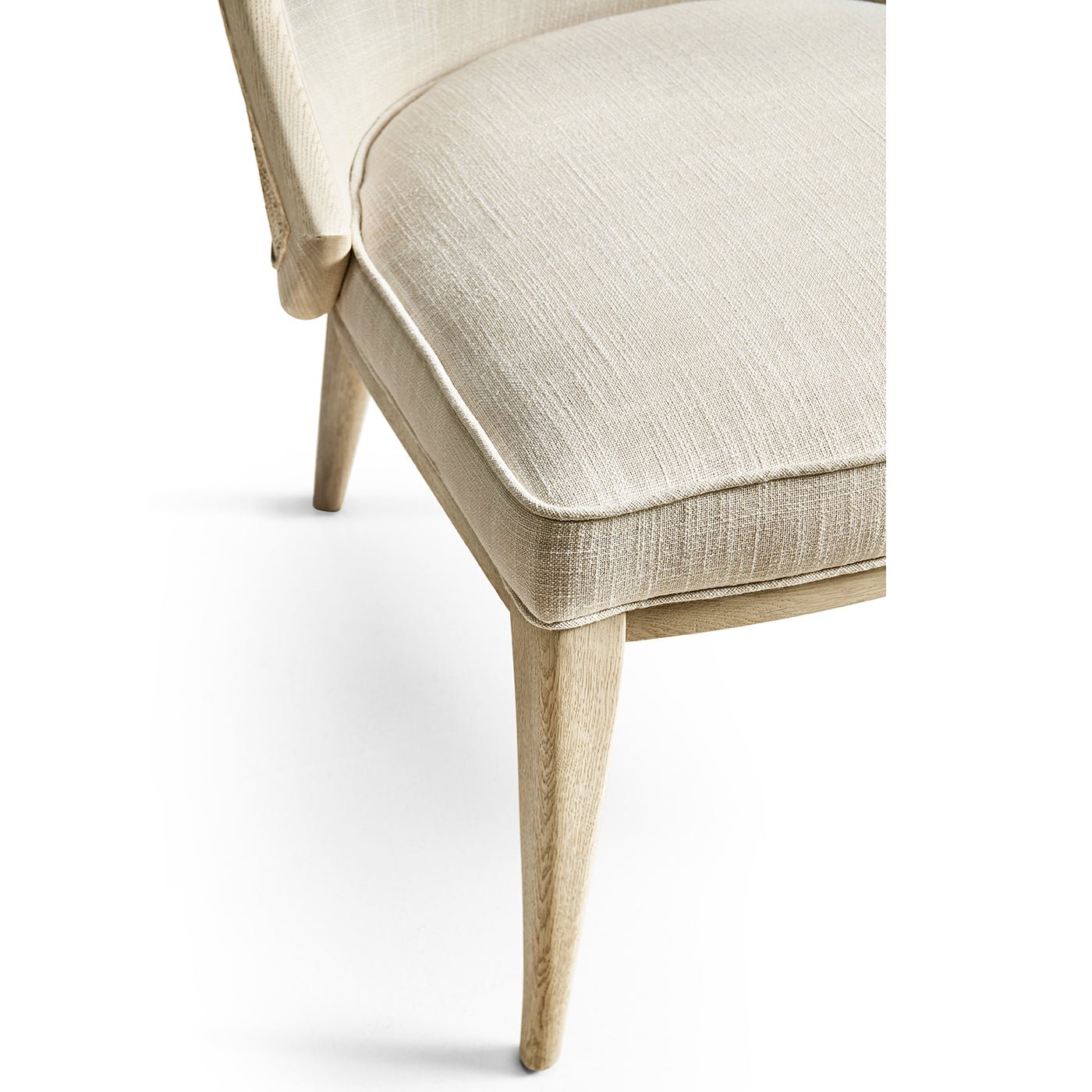 Front leg detail modern coastal upholstered dining chair.