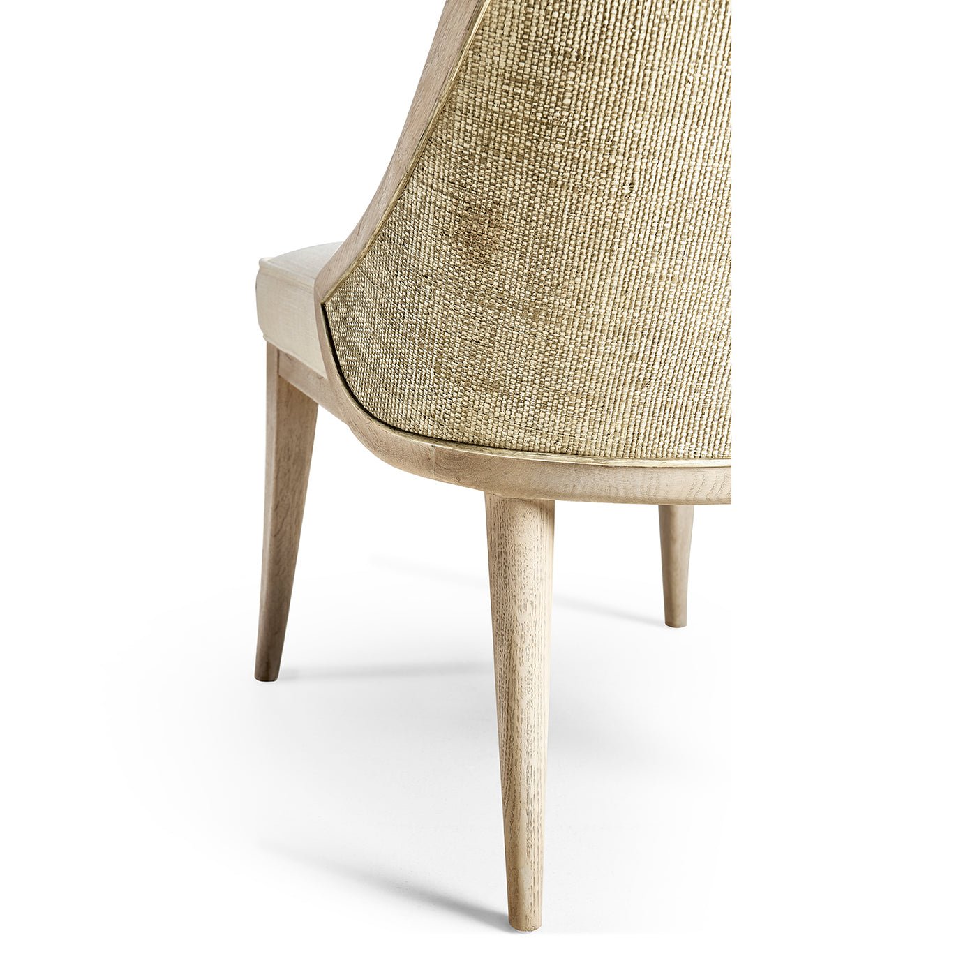 Rear leg detail modern coastal upholstered dining chair.