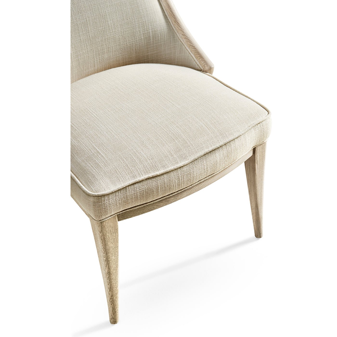 Close-up seat cushion modern coastal upholstered dining chair.