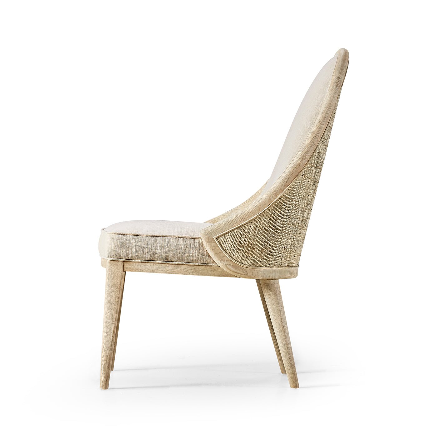Side profile modern coastal upholstered dining chair.