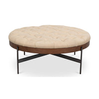 Round cocktail ottoman front view on white background.