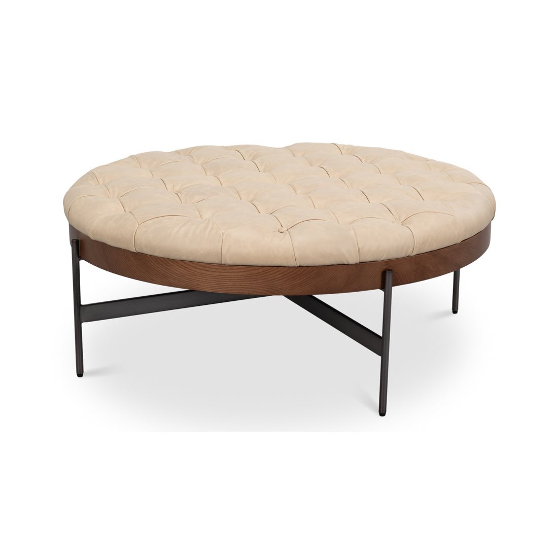 Side angle of round cocktail ottoman with metal legs.