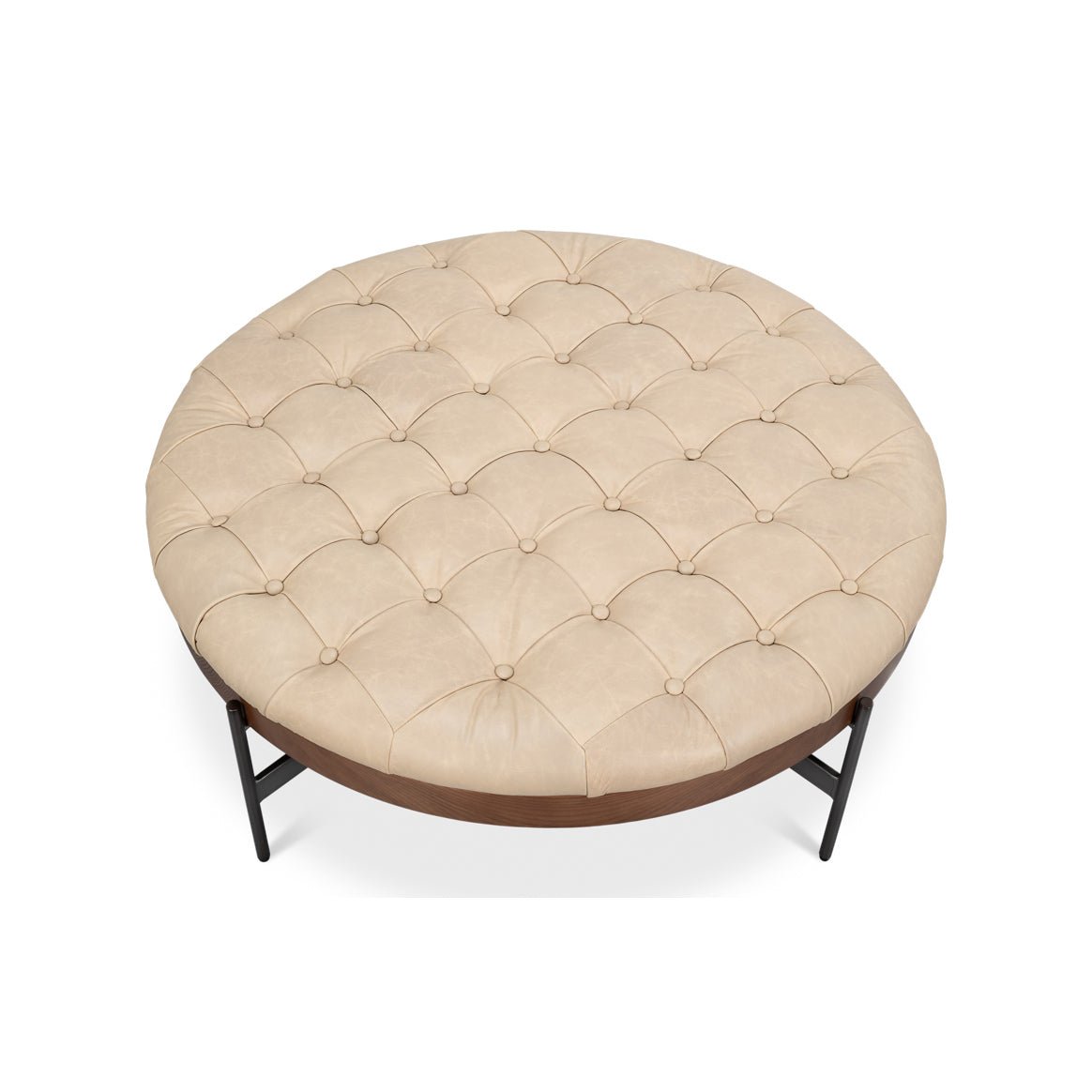 Top view of tufted round cocktail ottoman surface.