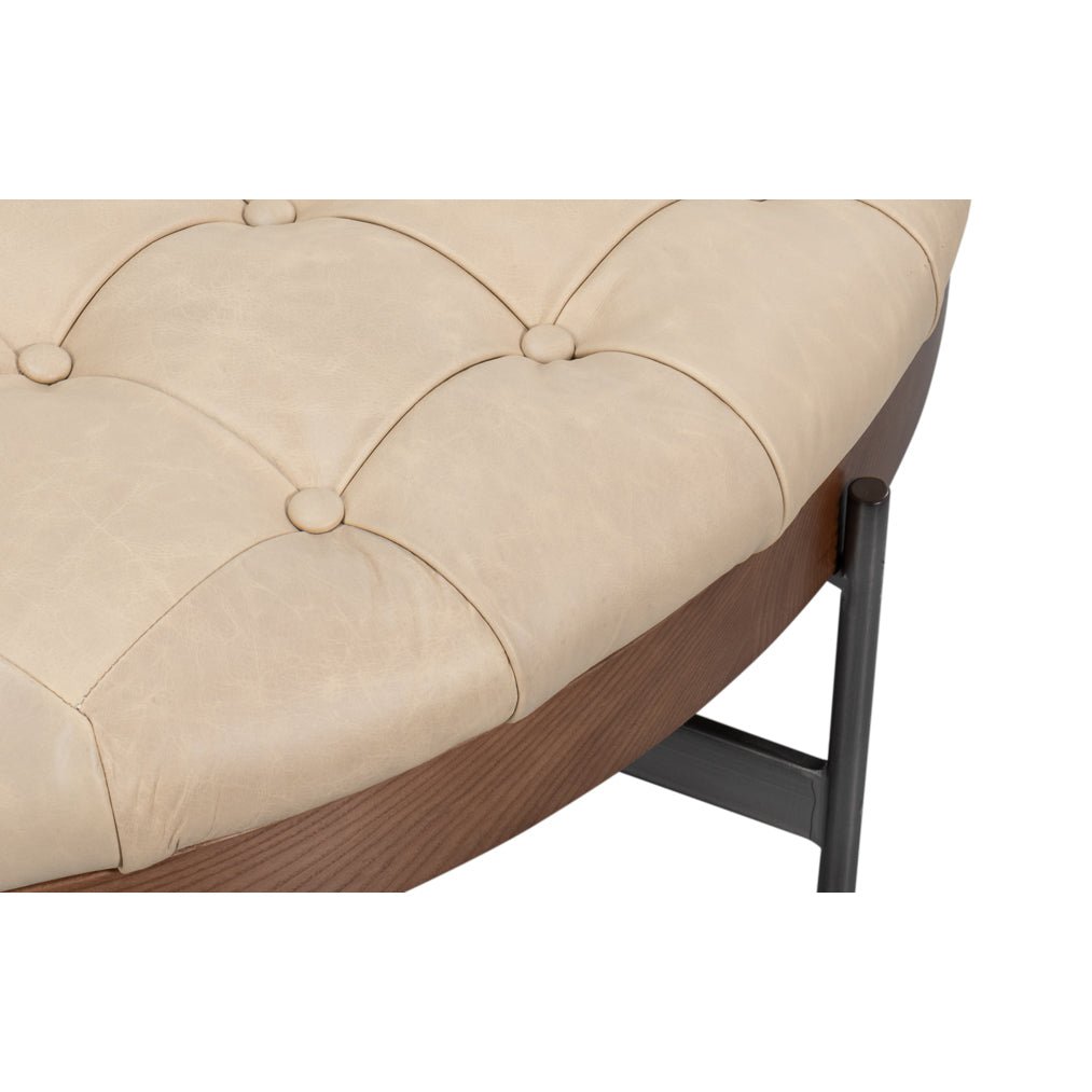 Close-up of ottoman's plush tufted detailing.