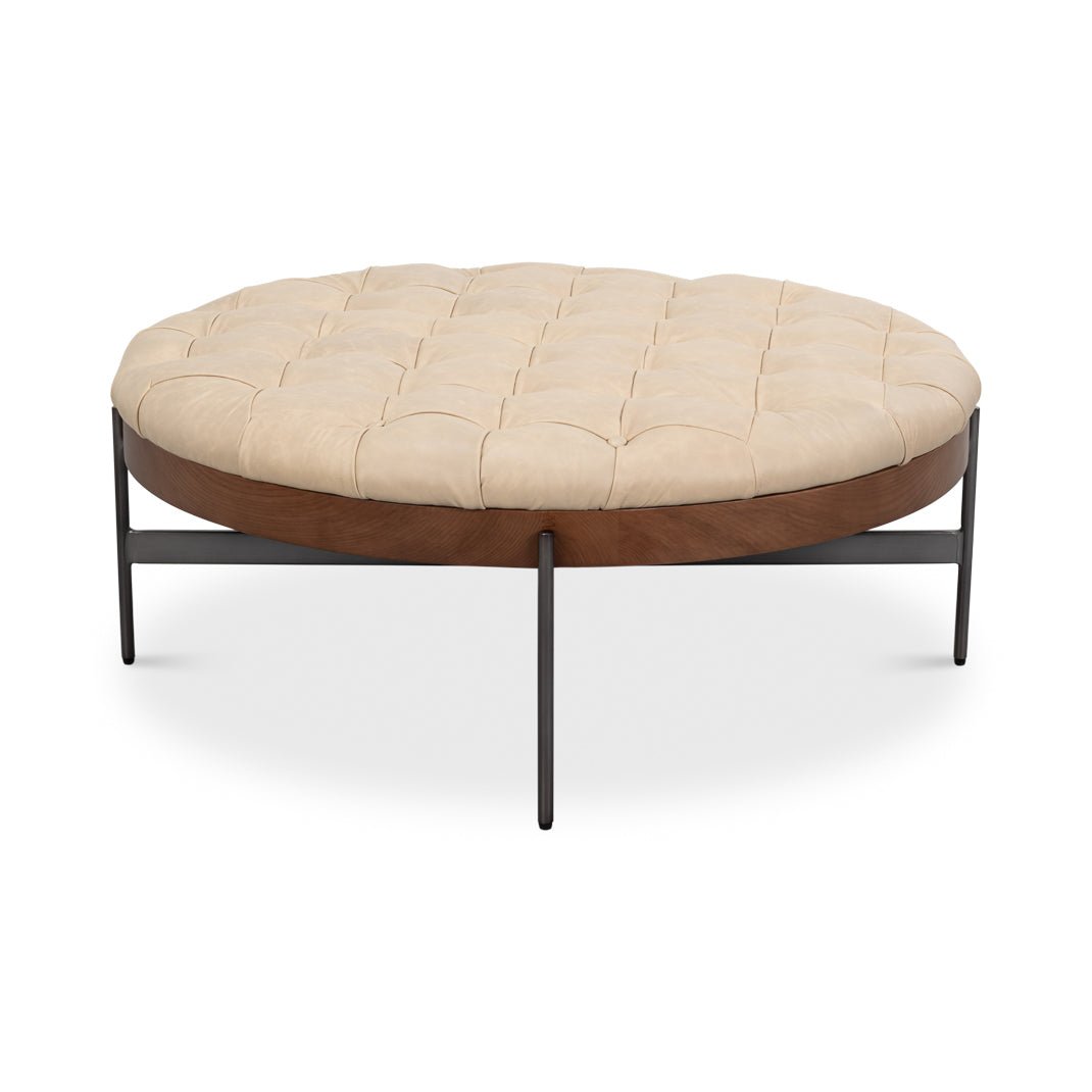 Front view of round cocktail ottoman with metal frame.