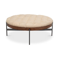 Front view of round cocktail ottoman with metal frame.