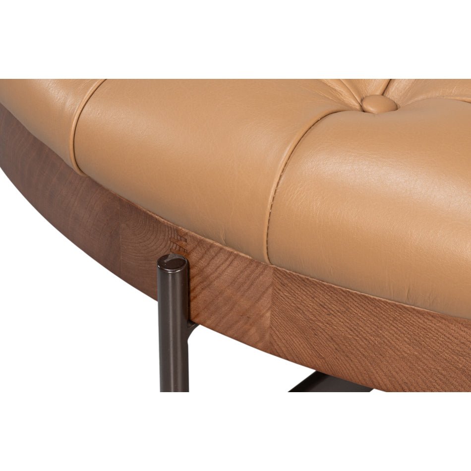 Edge details of leather ottoman and wood base.